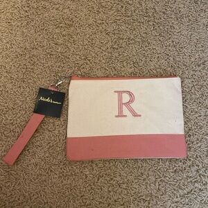 Very cute clutch initial R bag. Never been used and still new with tags!!!